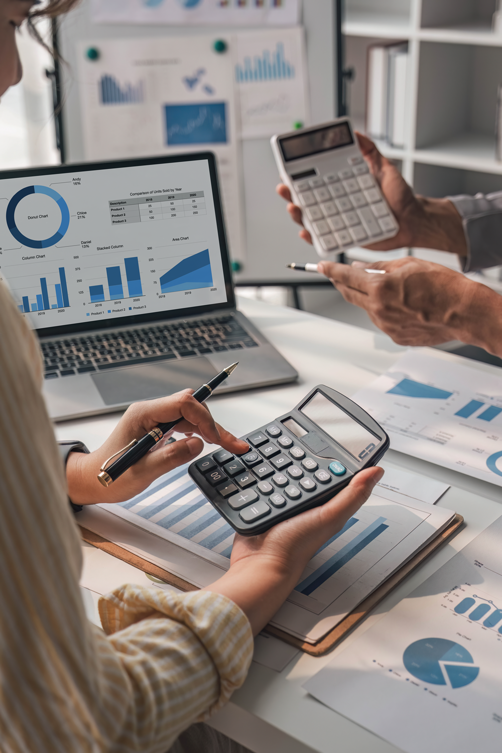 People analyzing financial data with calculators