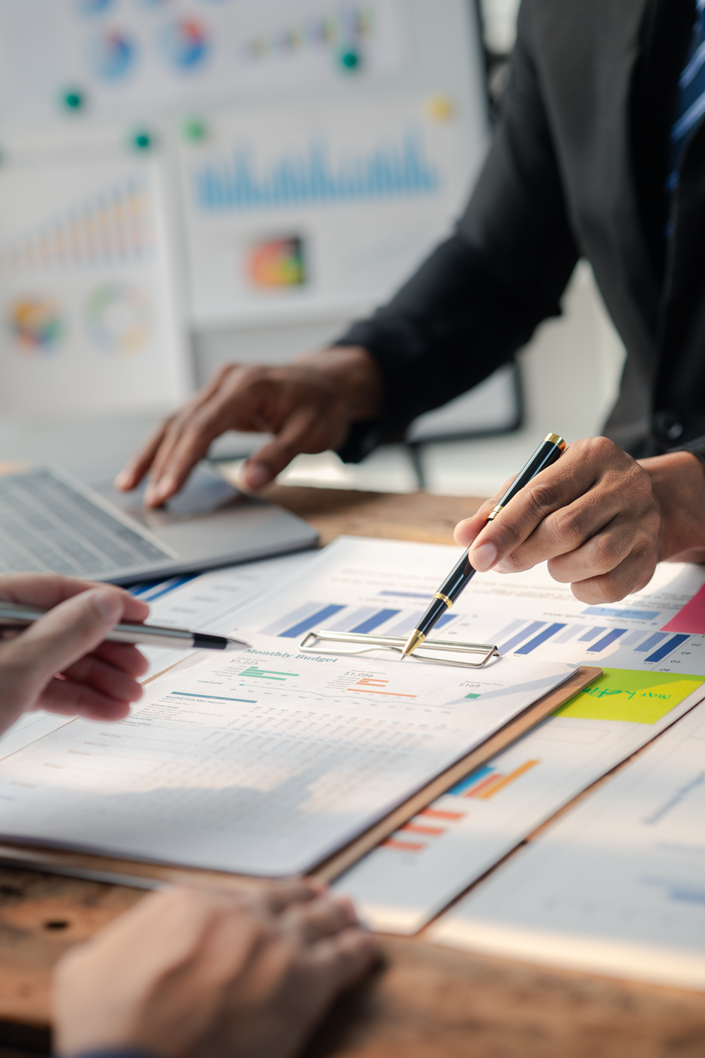 Business professionals analyzing financial charts and graphs