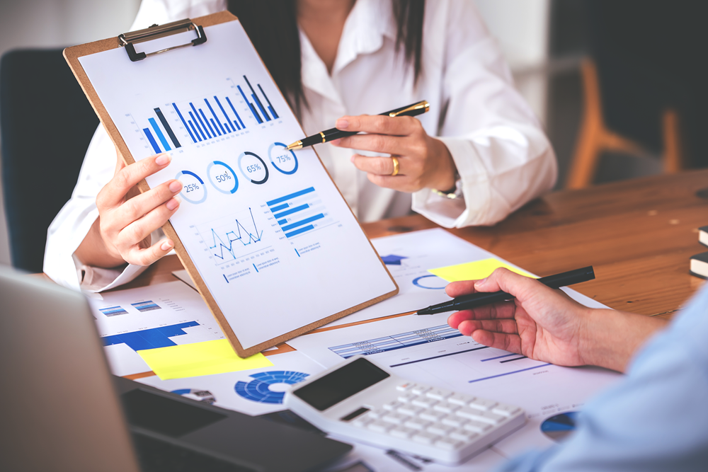 Business team analyzing financial data and charts.