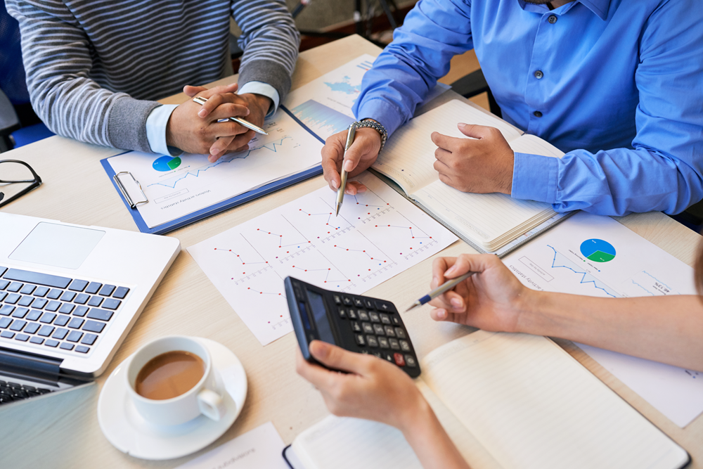 Business meeting with charts and calculations teamwork